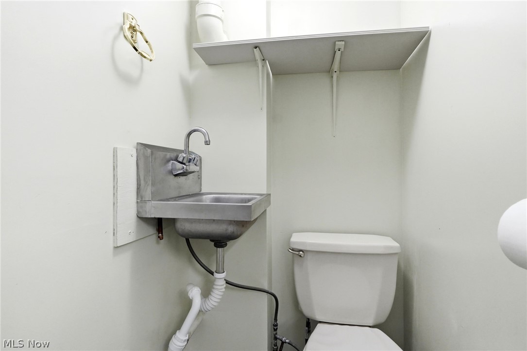 7001 State Road Parma, OH 44134 - Photo 39 of 50 half bath in garage!