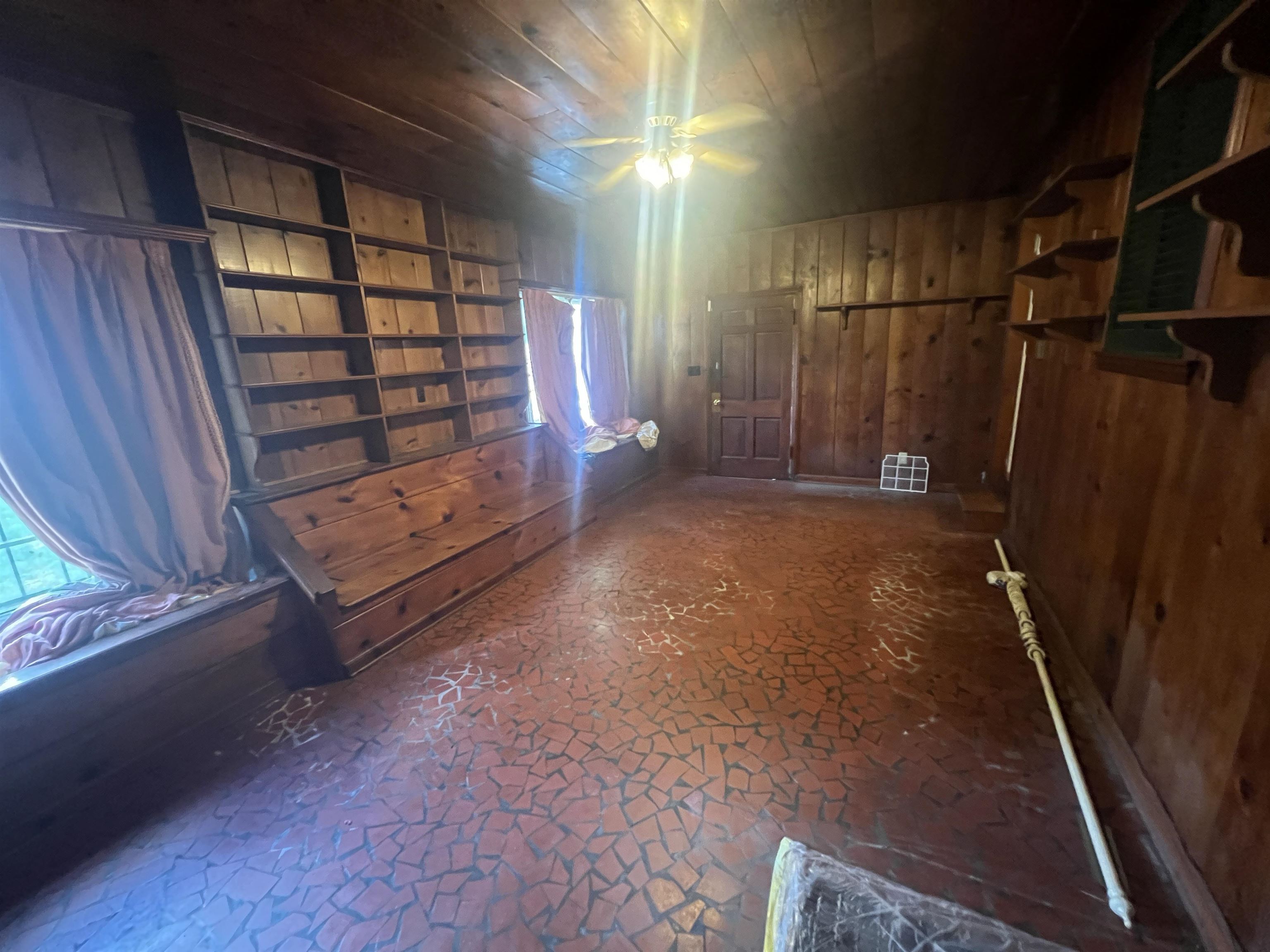 632 Spring Street Memphis, TN 38112 - Photo 20 of 37 Interior space featuring wooden walls and ceiling fan