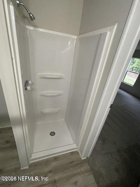 67089 Elnora Lane Yulee, FL 32097 - Photo 11 of 19 a bathroom with a glass door shower