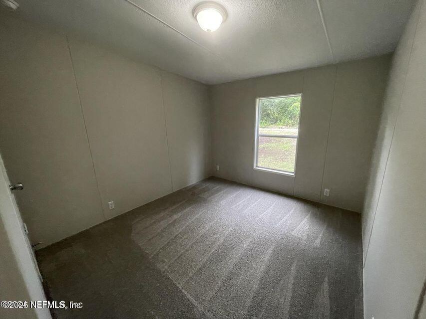 67089 Elnora Lane Yulee, FL 32097 - Photo 13 of 19 an empty room with a window