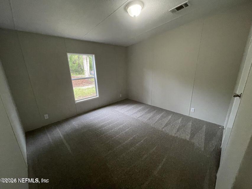 67089 Elnora Lane Yulee, FL 32097 - Photo 18 of 19 a view of an empty room with a window