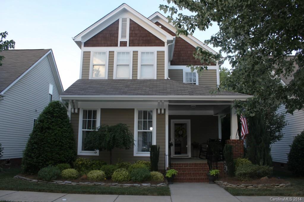 8135 Townley Road Huntersville, NC 28078 - Photo 1 of 21 a front view of a house with garden