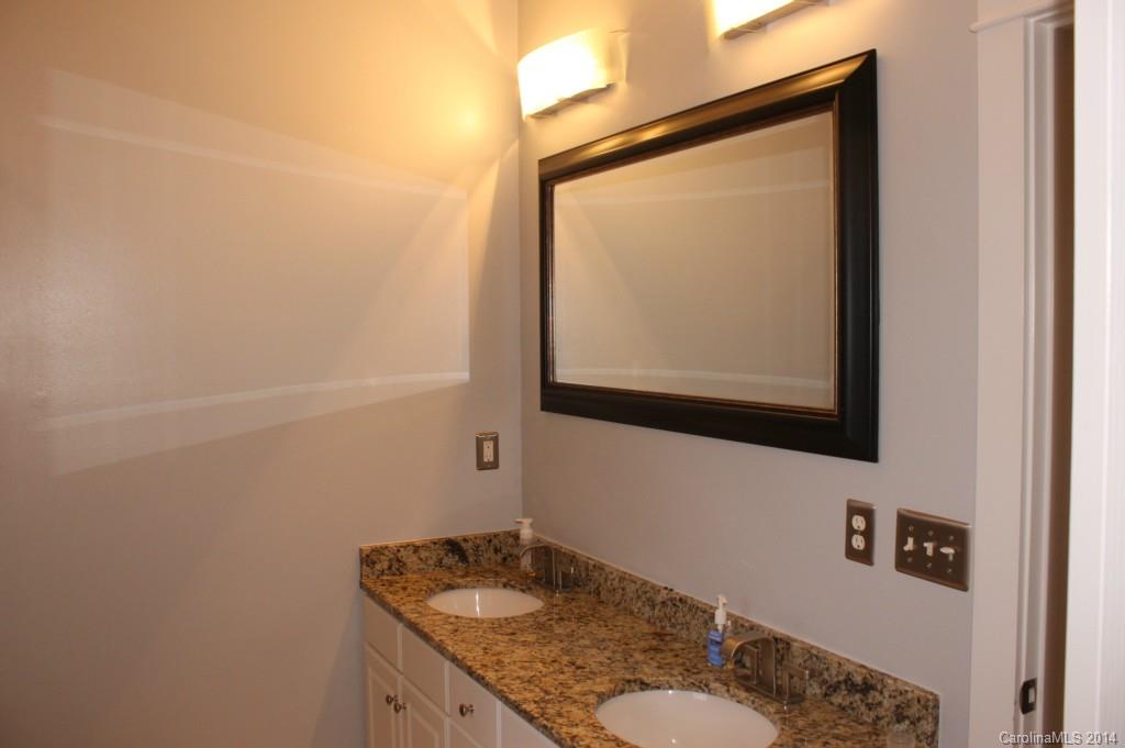 8135 Townley Road Huntersville, NC 28078 - Photo 9 of 21 a bathroom with a granite countertop sink and a mirror