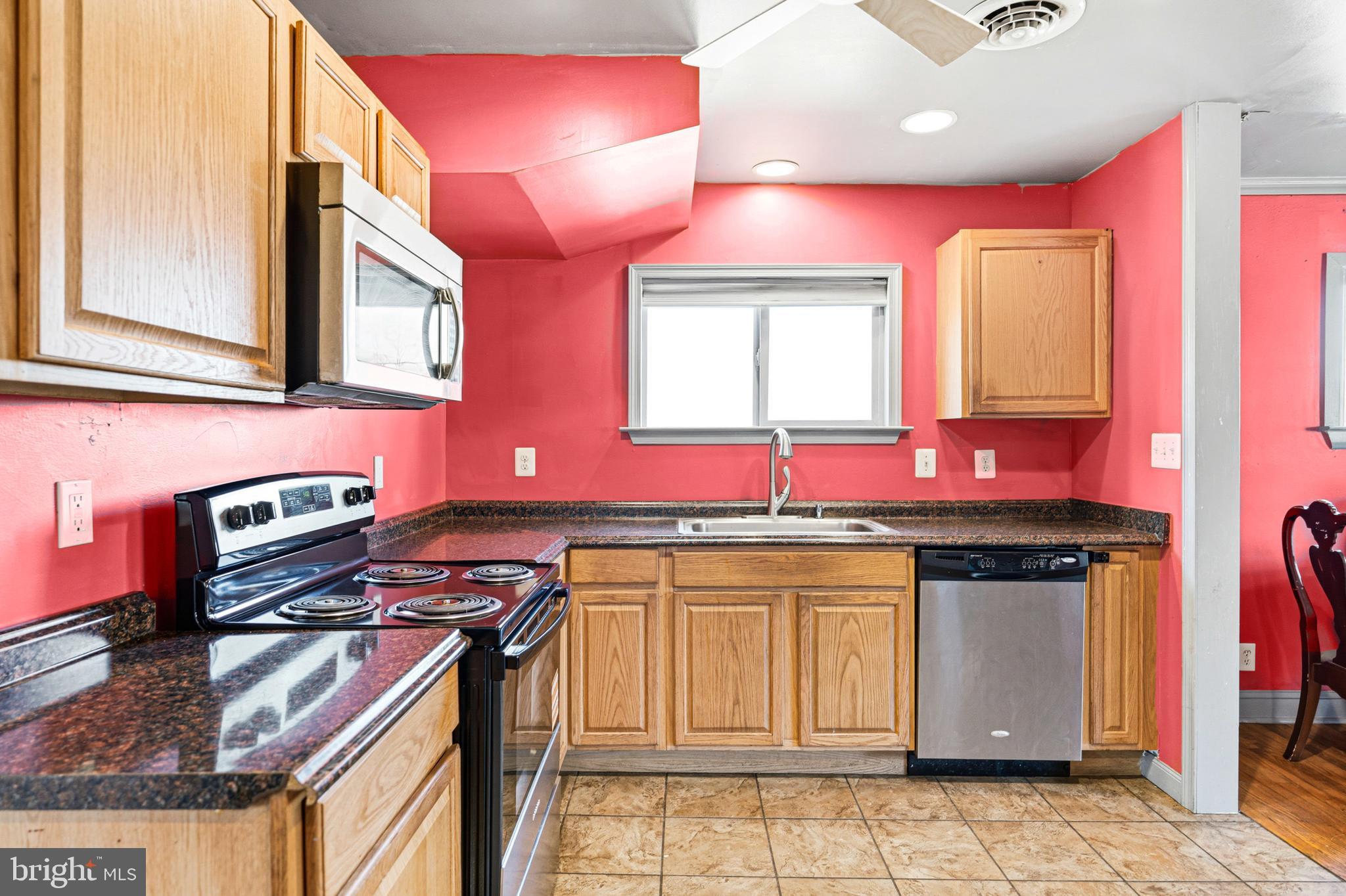 6156 Ripley Road La Plata, MD 20646 - Photo 16 of 26 a kitchen with stainless steel appliances granite countertop a stove a sink and a microwave