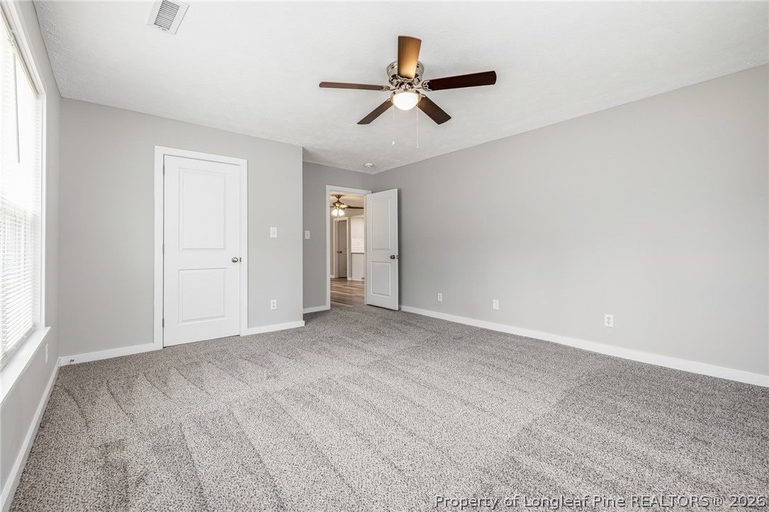 3524 Pine Log Road Lumberton, NC 28360 - Photo 17 of 42 a view of a livingroom with a ceiling fan and window