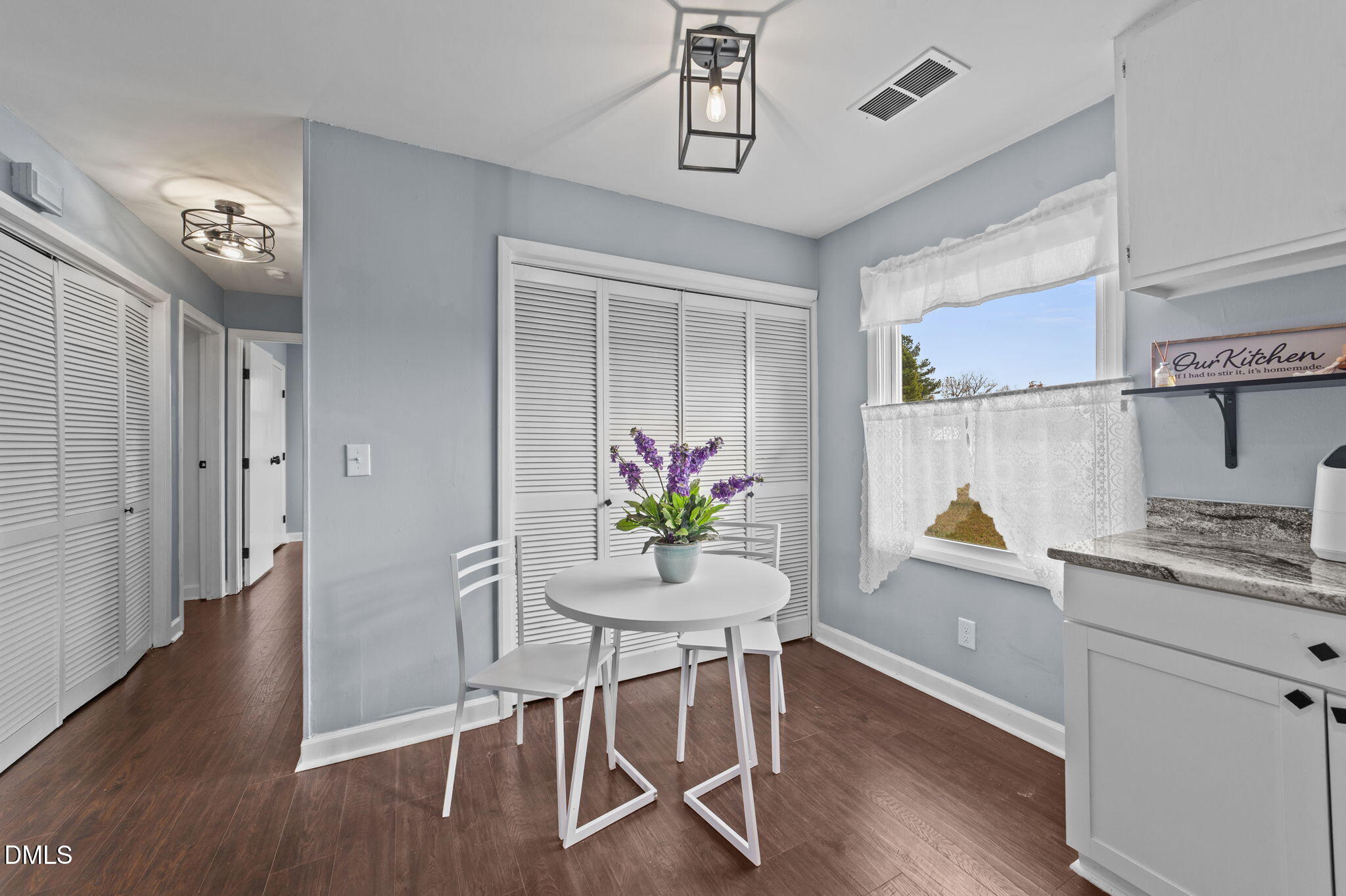 2874 Beulahtown Road Kenly, NC 27542 - Photo 11 of 40 a view of a dining room with furniture and wooden floor