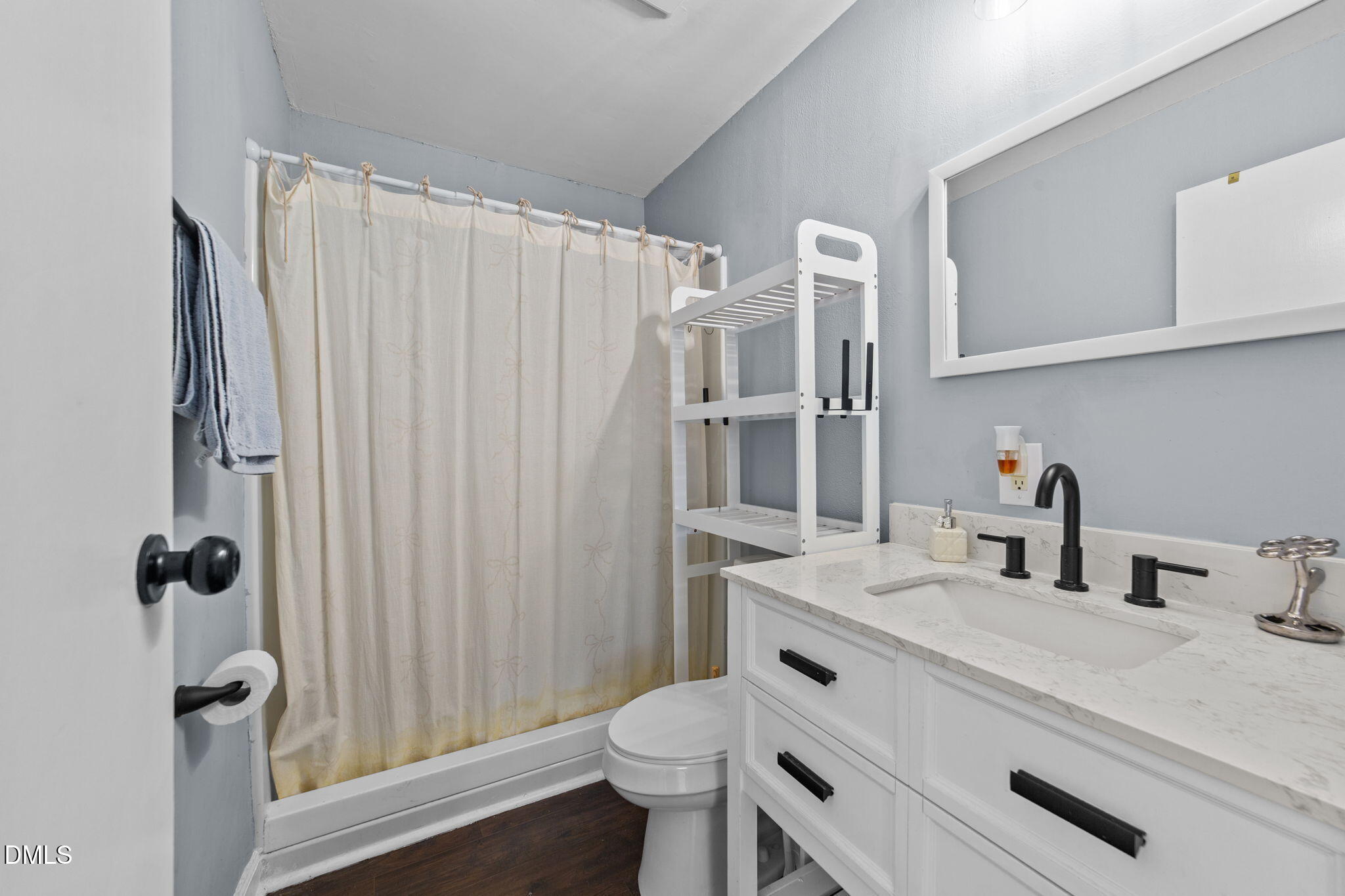 2874 Beulahtown Road Kenly, NC 27542 - Photo 15 of 40 a bathroom with a sink toilet and shower