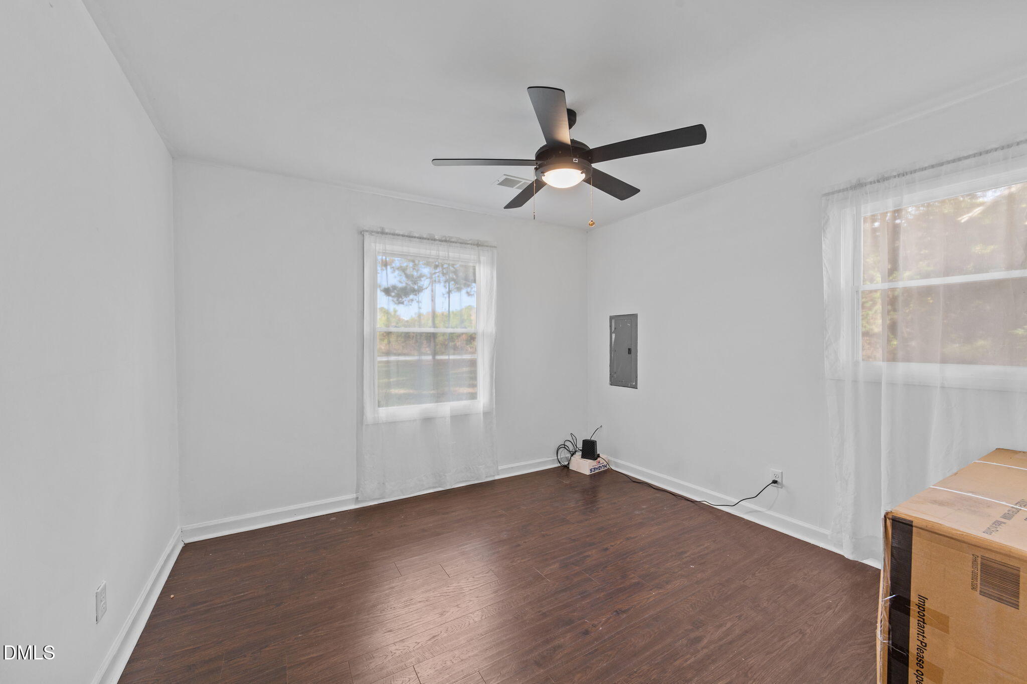 2874 Beulahtown Road Kenly, NC 27542 - Photo 16 of 40 a view of empty room with wooden floor and fan