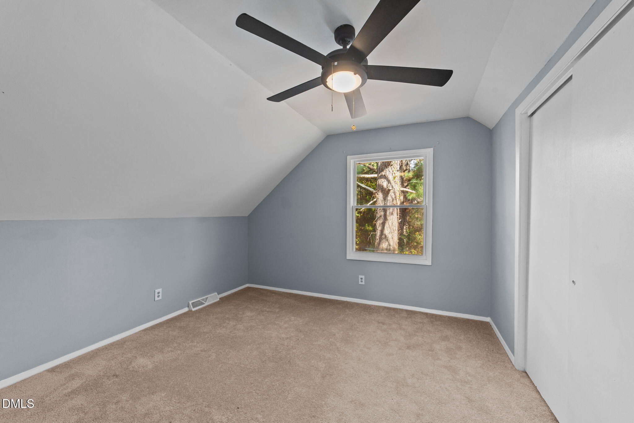 2874 Beulahtown Road Kenly, NC 27542 - Photo 22 of 40 an empty room with a window and a fan