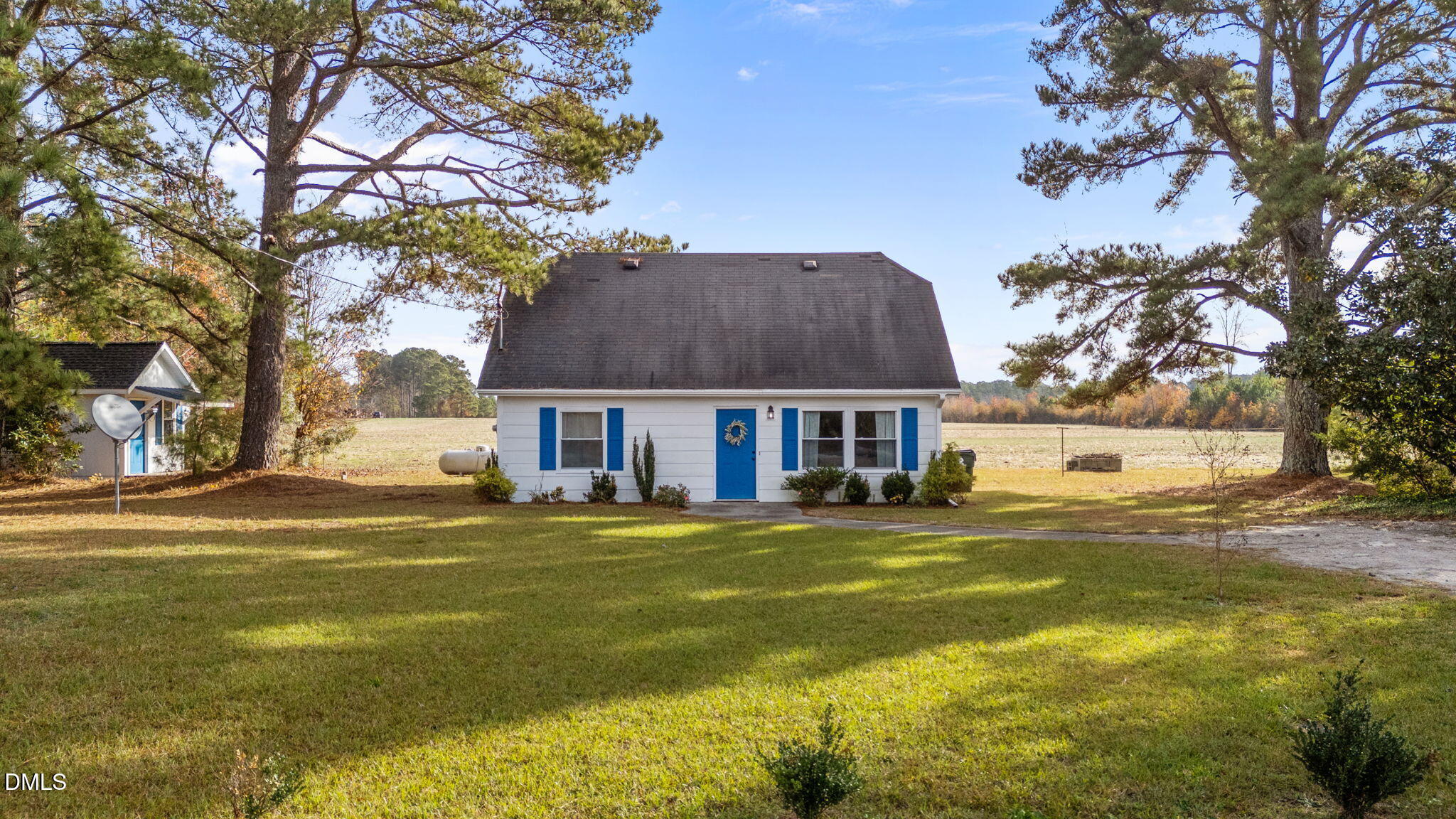 2874 Beulahtown Road Kenly, NC 27542 - Photo 25 of 40 a view of a house with a big yard and large trees