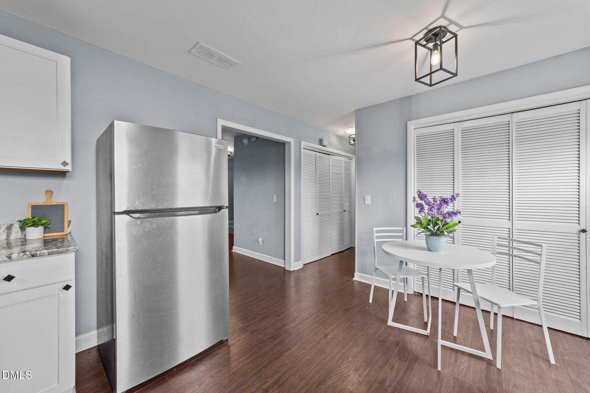2874 Beulahtown Road Kenly, NC 27542 - Photo 10 of 40 a kitchen with wooden floor and stainless steel appliances