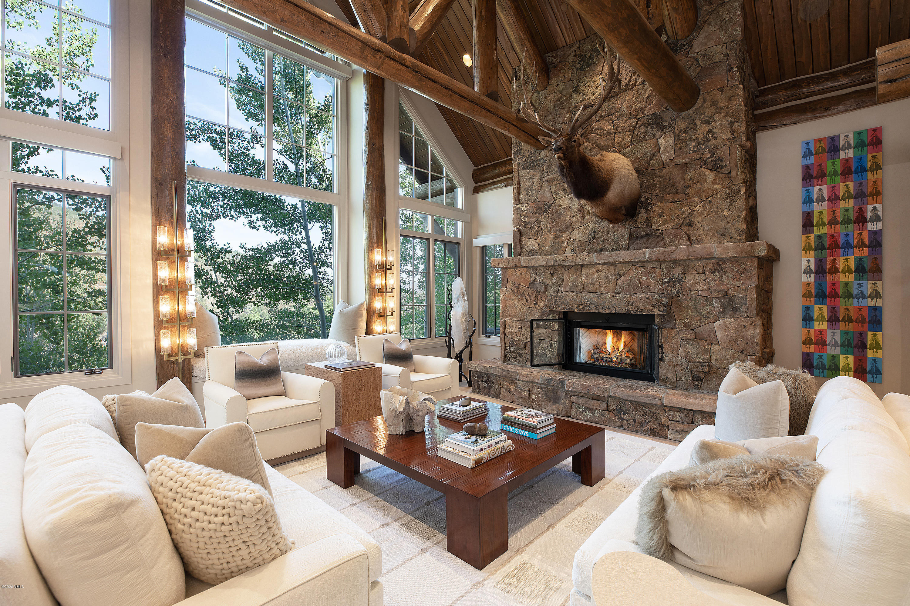 2178 Cresta Road Edwards, CO 81632 - Photo 3 of 15 a living room with furniture a fireplace and a large window
