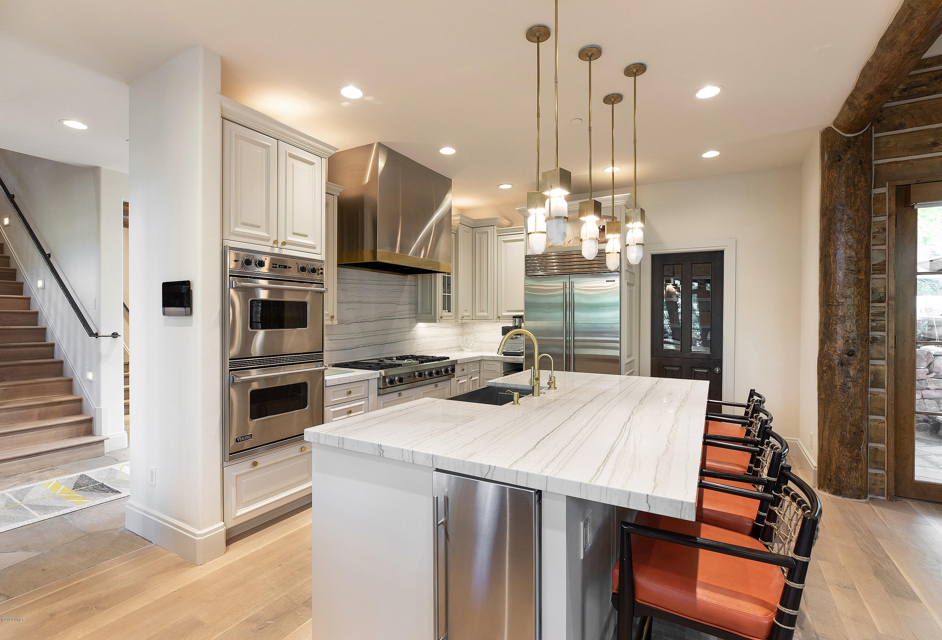 2178 Cresta Road Edwards, CO 81632 - Photo 6 of 15 a kitchen with stainless steel appliances kitchen island granite countertop a stove a sink and a refrigerator