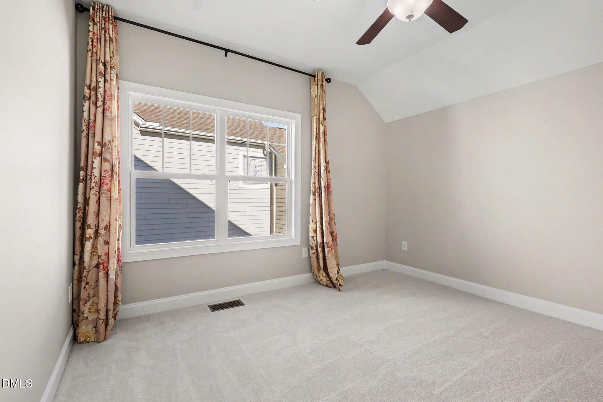 1213 Hemby Ridge Lane Morrisville, NC 27560 - Photo 40 of 60 an empty room with windows