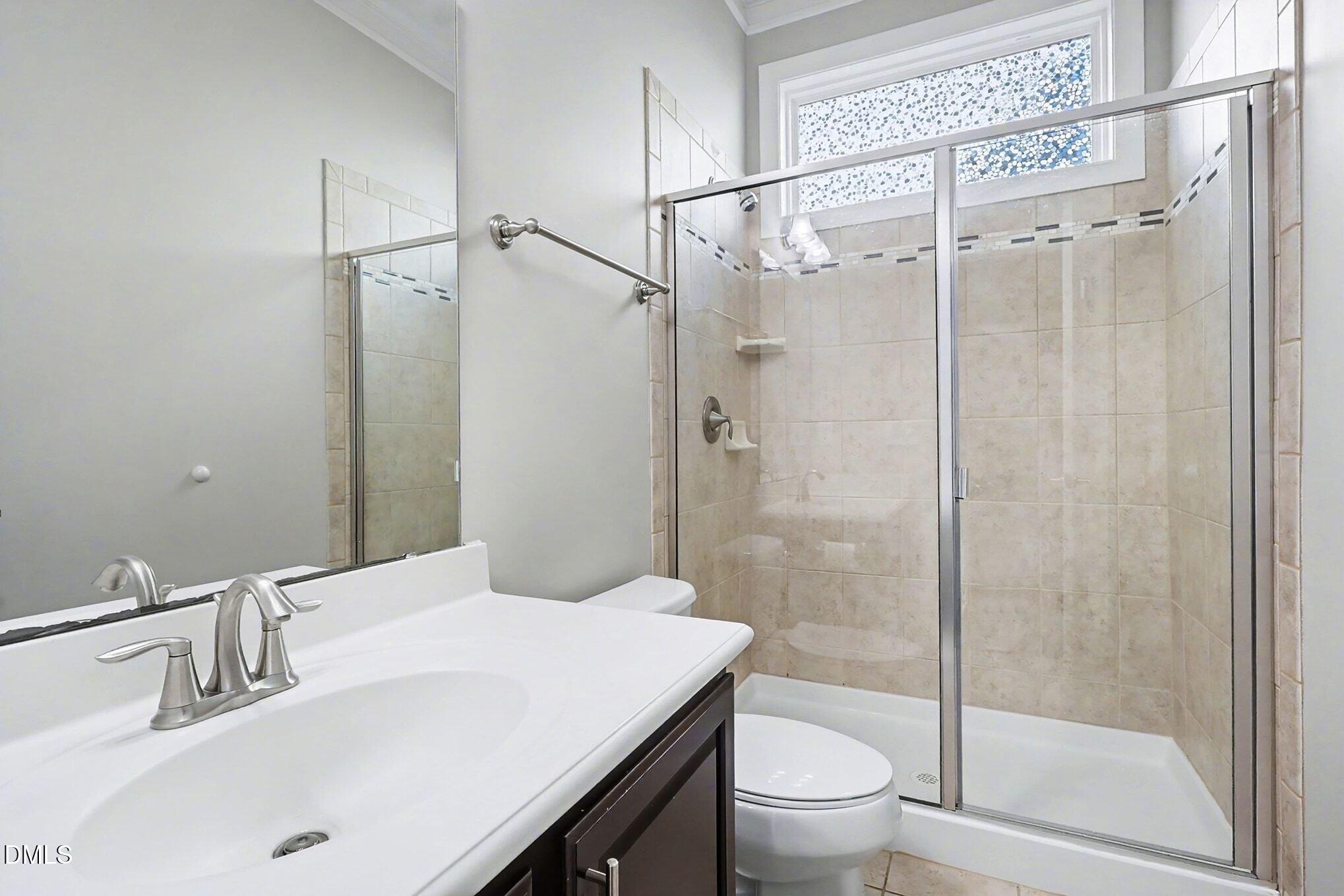 1213 Hemby Ridge Lane Morrisville, NC 27560 - Photo 44 of 60 a bathroom with a sink and a mirror
