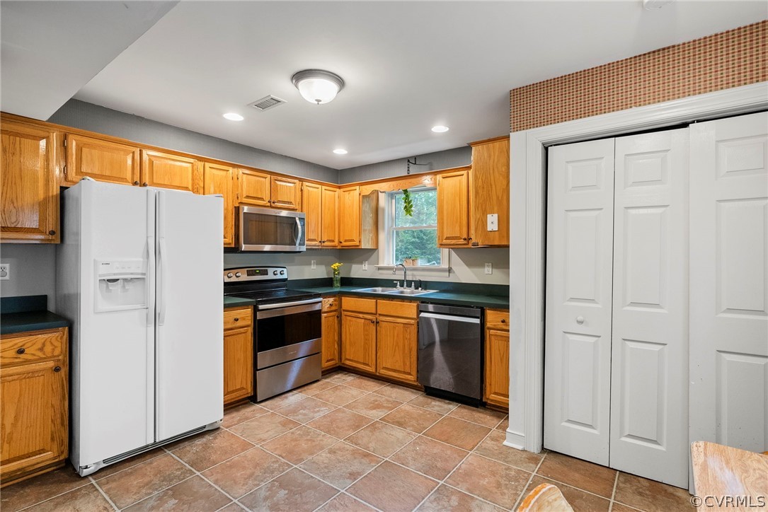 1775 Hawk Town Road Maidens, VA 23102 - Photo 12 of 27 a kitchen with stainless steel appliances granite countertop a refrigerator and a stove top oven
