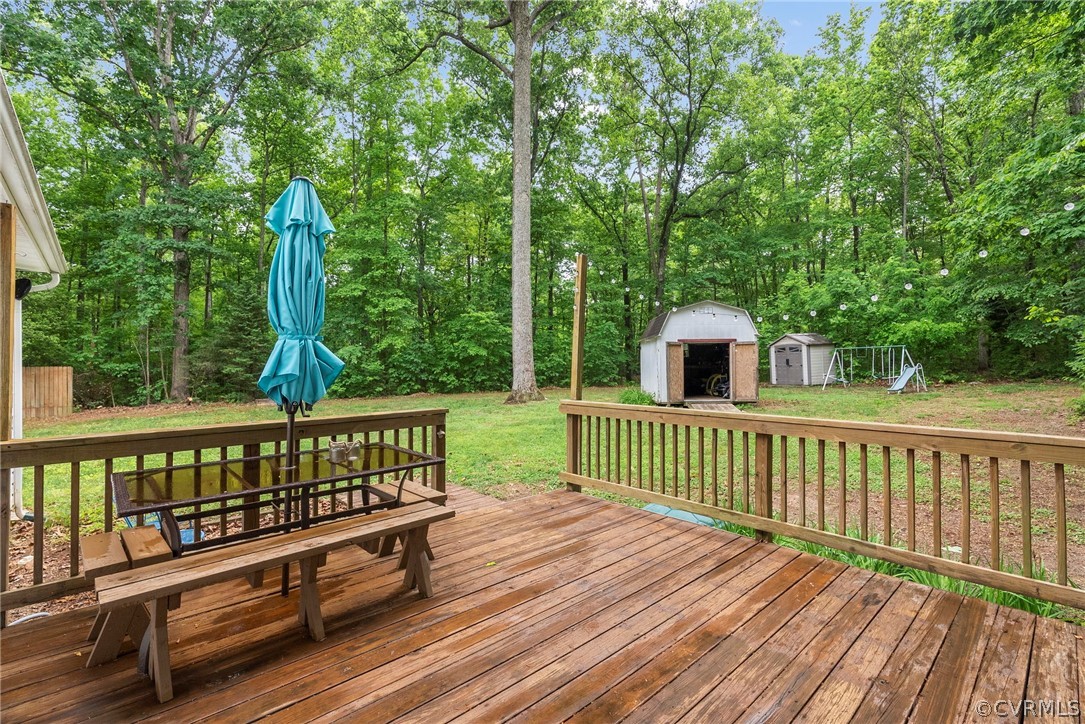 1775 Hawk Town Road Maidens, VA 23102 - Photo 23 of 27 a view of a wooden deck with a yard