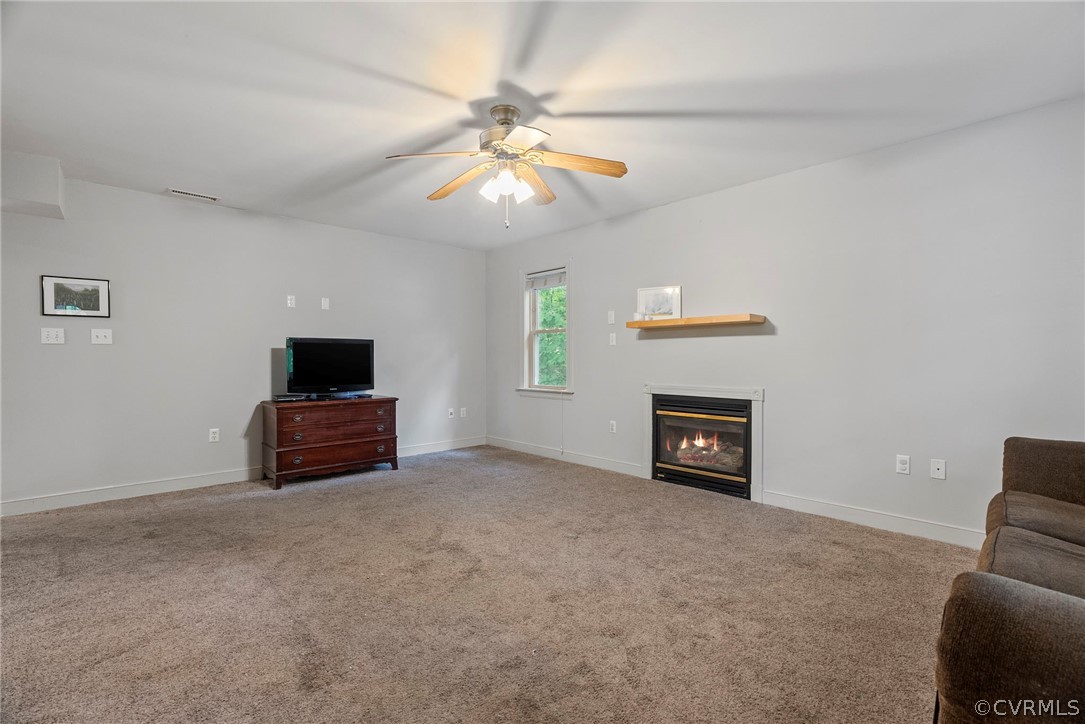 1775 Hawk Town Road Maidens, VA 23102 - Photo 4 of 27 a living room with furniture and a flat screen tv