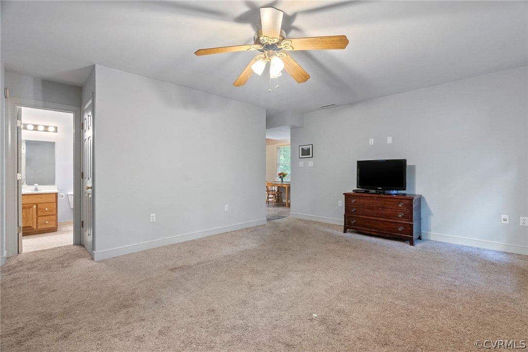 1775 Hawk Town Road Maidens, VA 23102 - Photo 5 of 27 an empty room with furniture and a flat screen tv