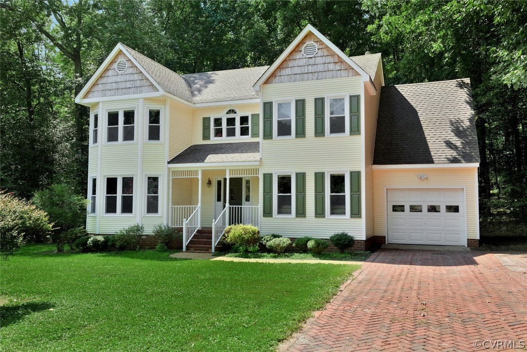 14903 Gates Mill Road Midlothian, VA 23112 - Photo 2 of 34 a front view of a house with a yard