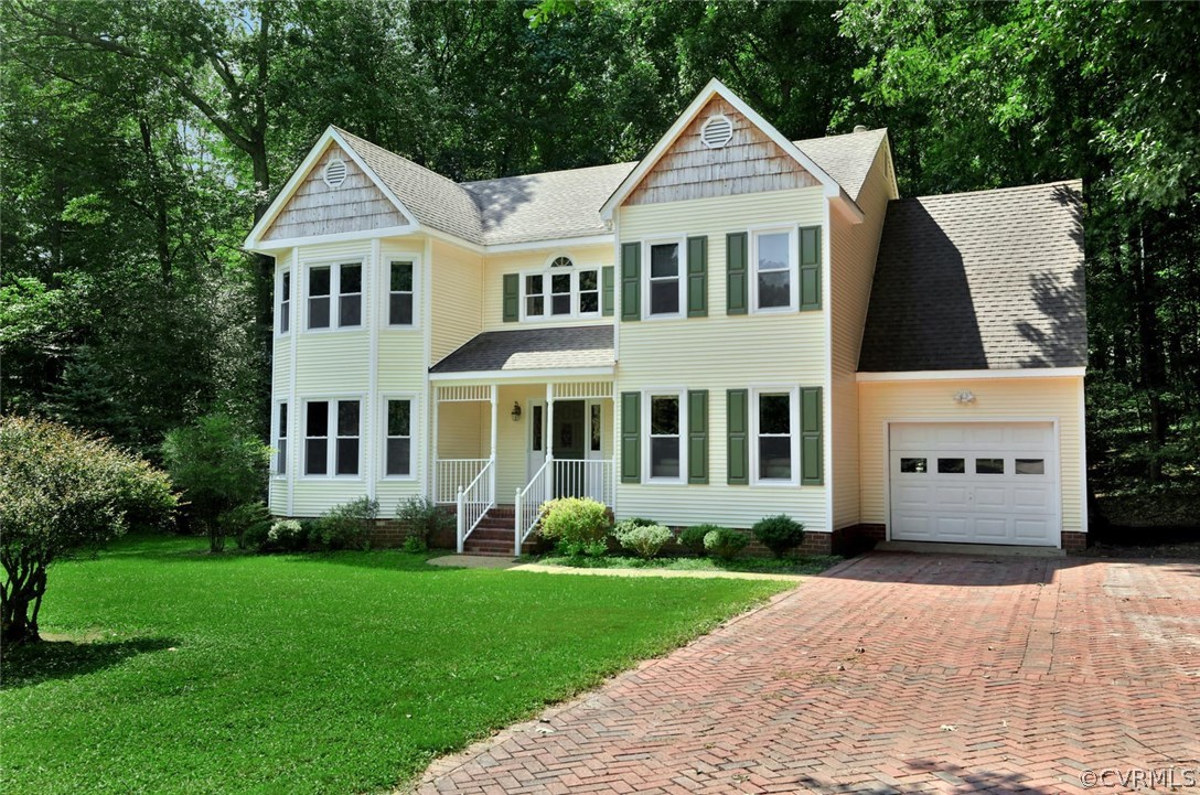 14903 Gates Mill Road Midlothian, VA 23112 - Photo 3 of 34 a front view of a house with a yard and trees