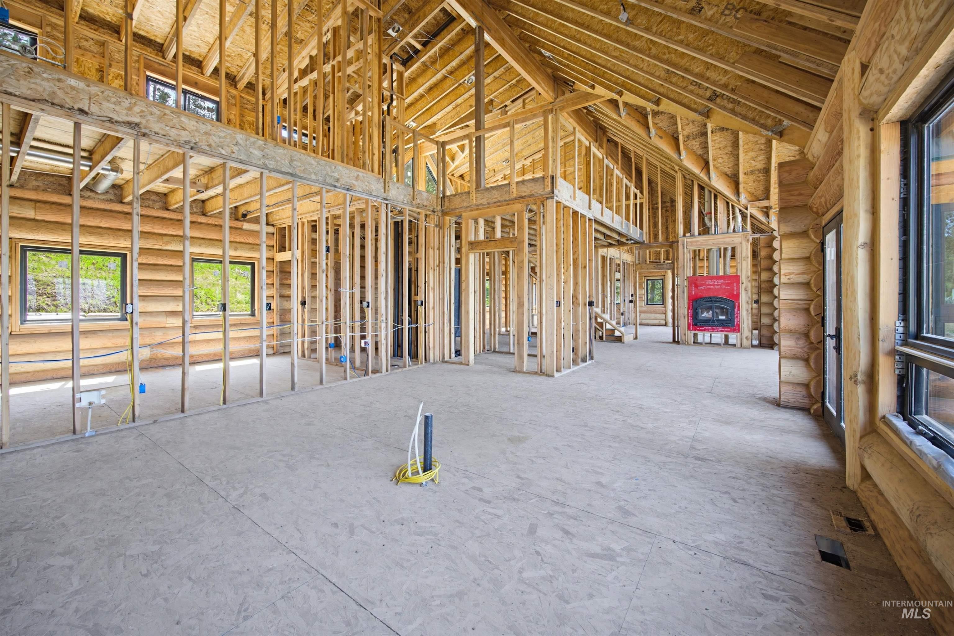 3322 Big Creek Road New Meadows, ID 83654 - Photo 42 of 50 Open-concept interior framing featuring exposed wood beams and log walls