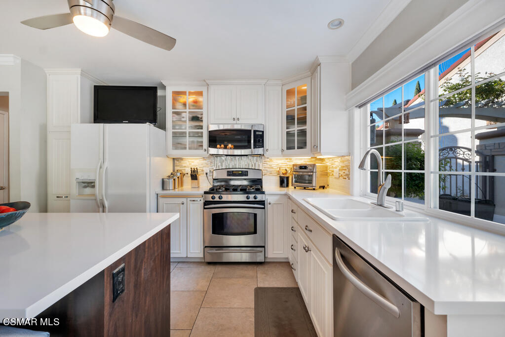2932 Morningside Drive Thousand Oaks, CA 91362 - Photo 12 of 39 a kitchen with stainless steel appliances a stove sink microwave and refrigerator