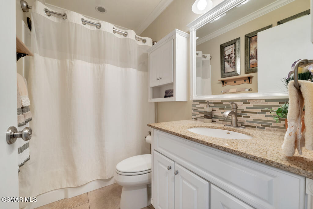 2932 Morningside Drive Thousand Oaks, CA 91362 - Photo 19 of 39 a bathroom with a granite countertop sink and a mirror