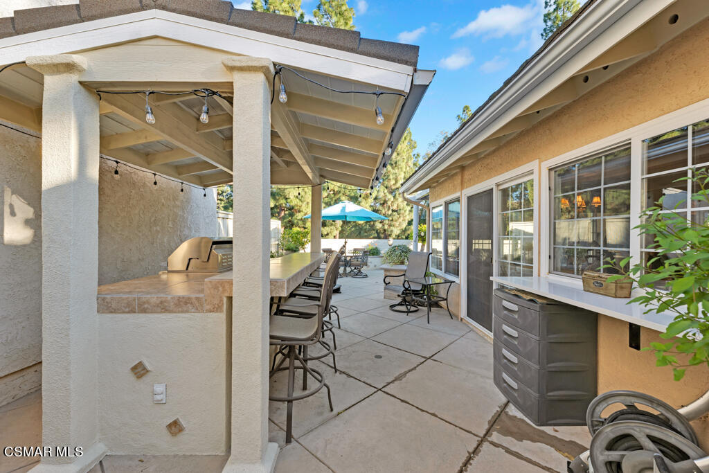 2932 Morningside Drive Thousand Oaks, CA 91362 - Photo 32 of 39 a front view of a house with outdoor seating and a potted plant