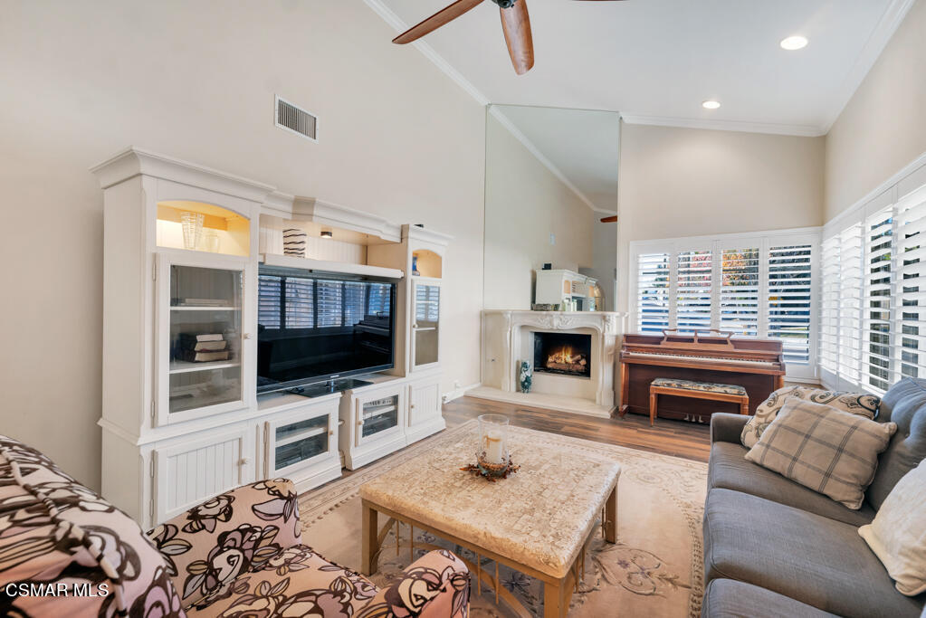 2932 Morningside Drive Thousand Oaks, CA 91362 - Photo 8 of 39 a living room with furniture a flat screen tv and a fireplace