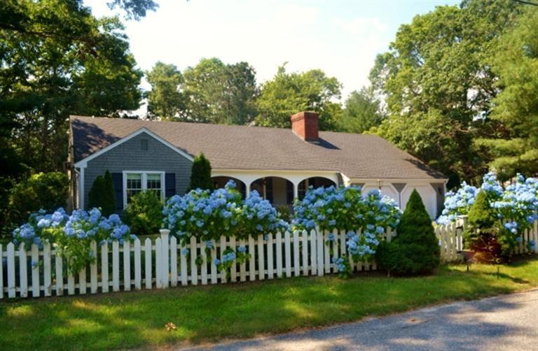 72 Rolling Hitch Road Centerville, MA 02632 - Photo 1 of 28 a front view of a house with garden