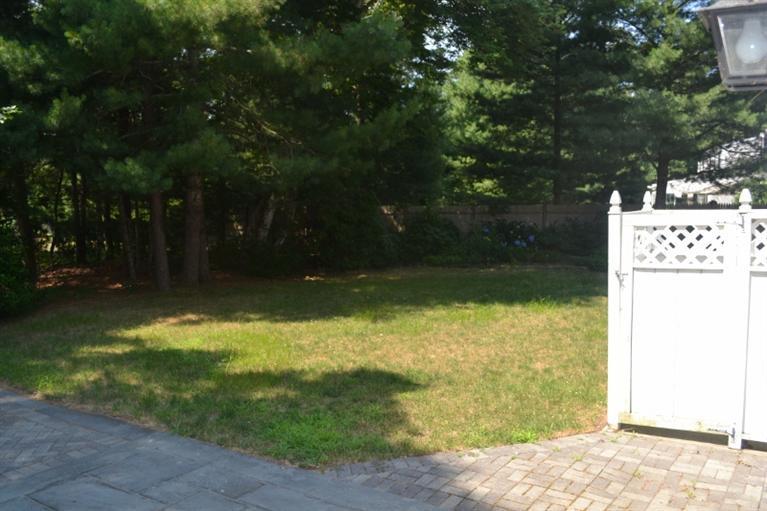 72 Rolling Hitch Road Centerville, MA 02632 - Photo 27 of 28 a backyard of a house with lots of green space