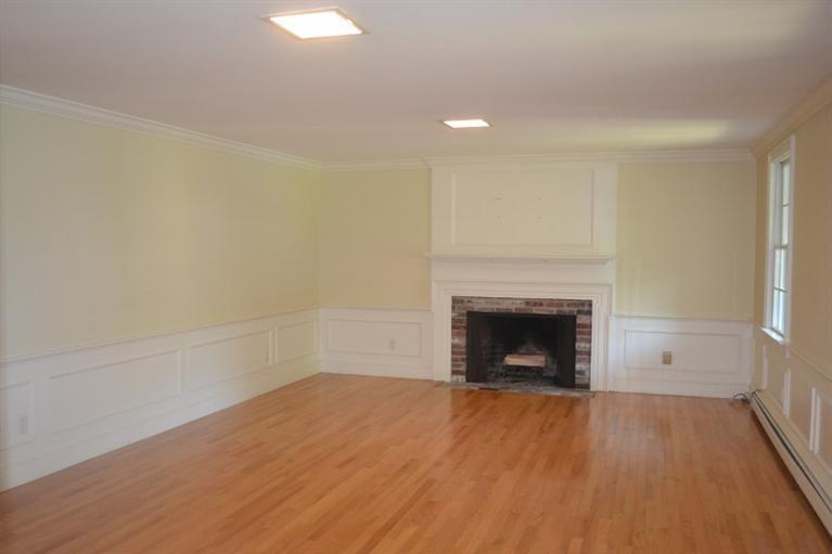 72 Rolling Hitch Road Centerville, MA 02632 - Photo 7 of 28 a view of an empty room with a fireplace and a window