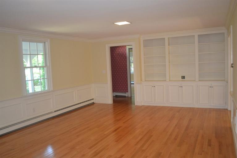 72 Rolling Hitch Road Centerville, MA 02632 - Photo 8 of 28 an empty room with wooden floor and windows