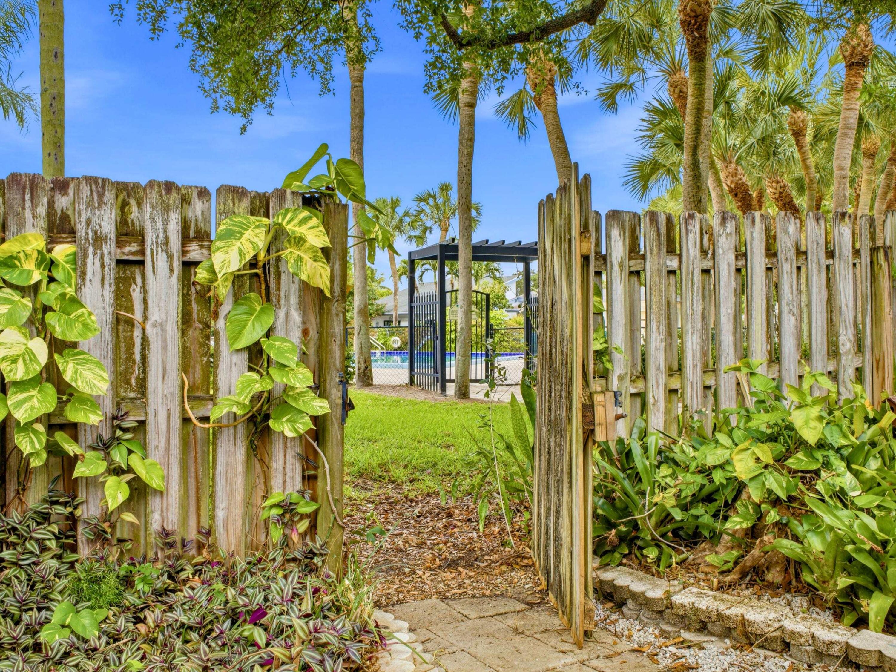 56 Baytree Circle Boynton Beach, FL 33436 - Photo 27 of 41 Path to Pool from House