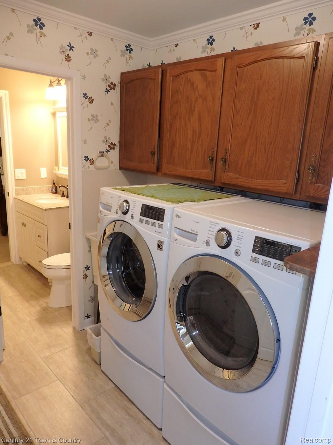 242 Poco Court Rochester, MI 48307 - Photo 44 of 45 First floor laundry room with new floor and appliances included