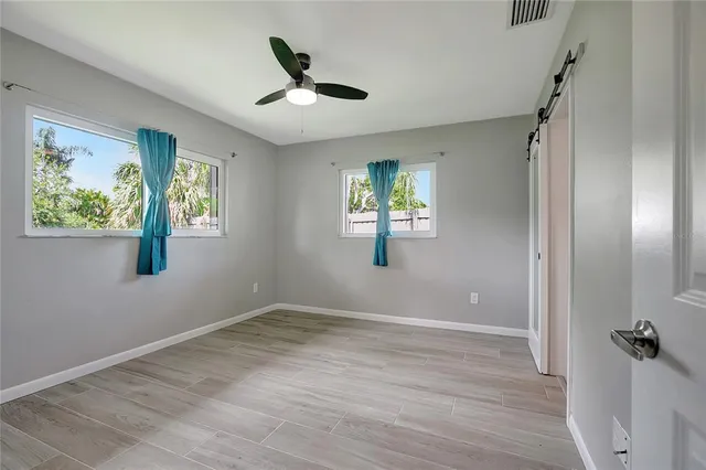 a bathroom with a toilet and a shower curtain