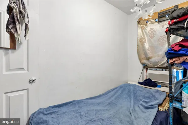 a view of small space with wooden floor and chair