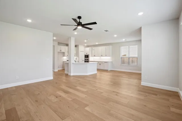 a view of a kitchen with a sink stainless steel appliances and cabinets