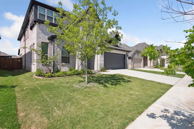 a backyard of a house with lots of green space