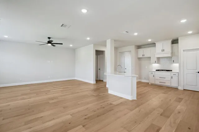 a view of a kitchen with furniture and cabinets