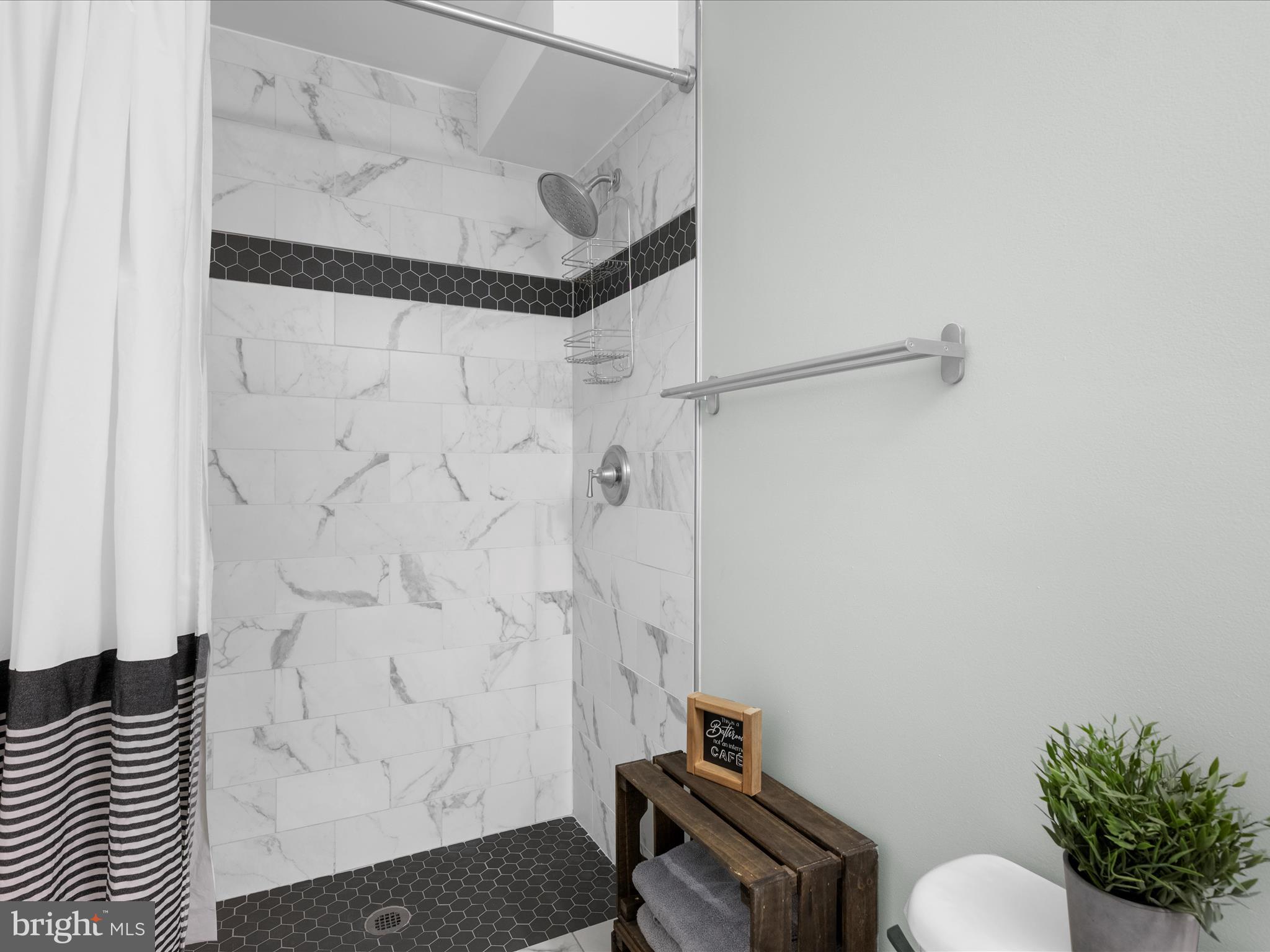 243 Seneca Terrace Pasadena, MD 21122 - Photo 21 of 35 a bathroom with a shower and a toilet