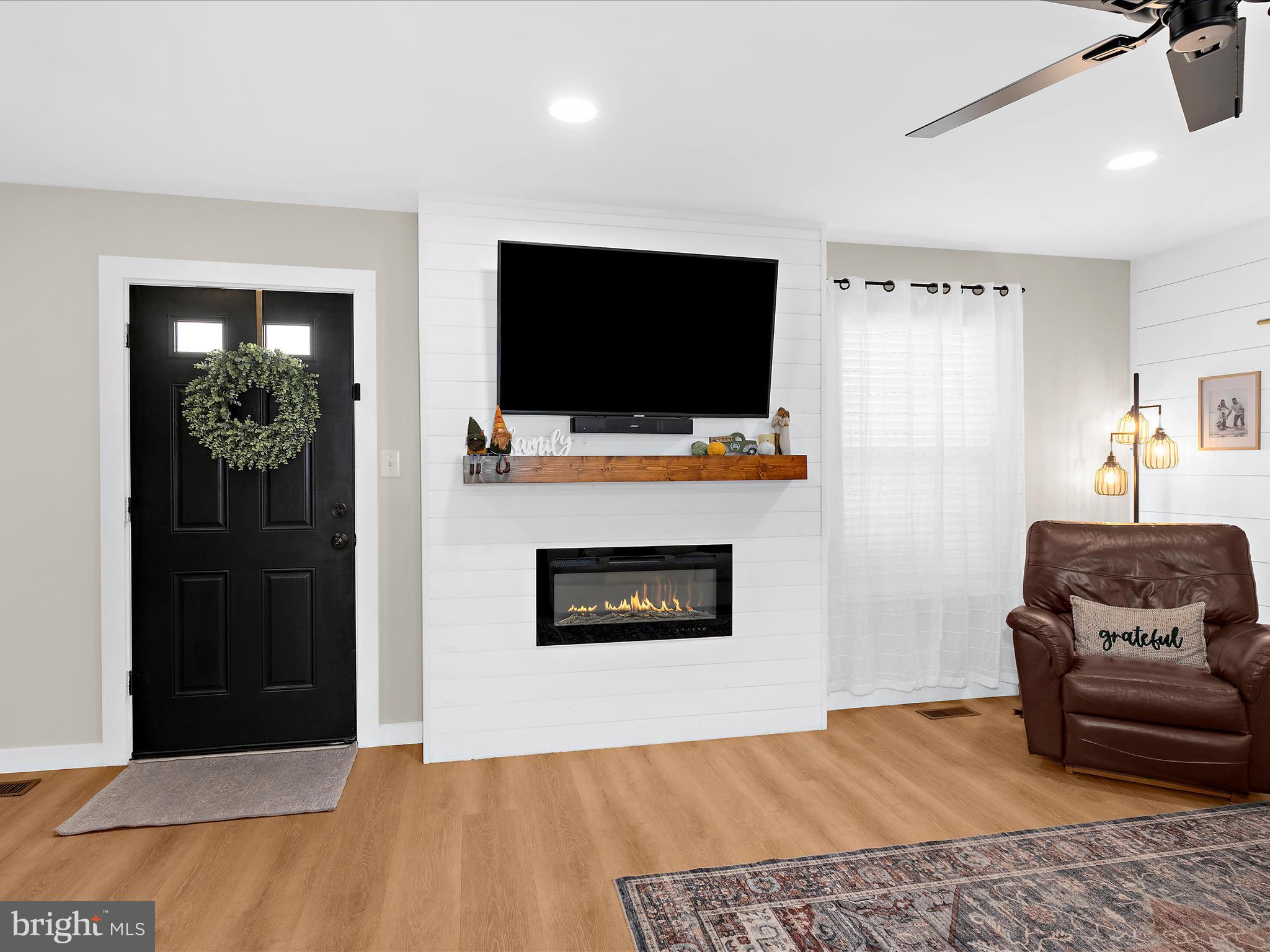 243 Seneca Terrace Pasadena, MD 21122 - Photo 6 of 35 a living room with furniture and a flat screen tv