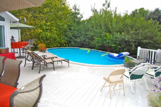 151 South Raddant Road Batavia, IL 60510 - Photo 14 of 16 a swimming pool with outdoor seating and yard