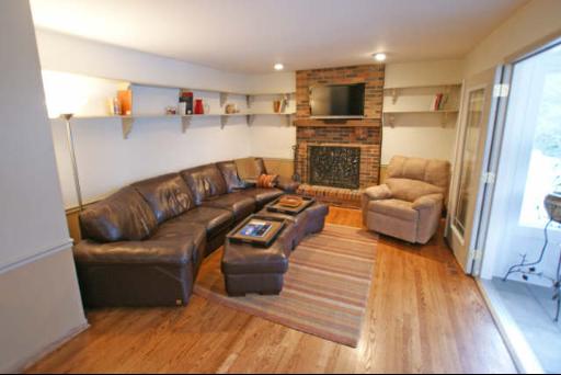 151 South Raddant Road Batavia, IL 60510 - Photo 6 of 16 a living room with furniture and a fireplace