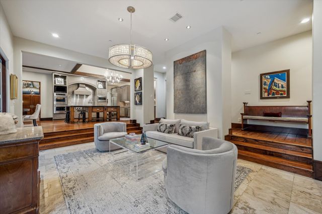 a living room with fireplace furniture and a flat screen tv