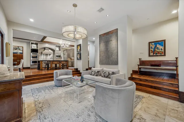 a living room with fireplace furniture and a flat screen tv