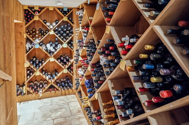 a view of a house with backyard sitting area and garden