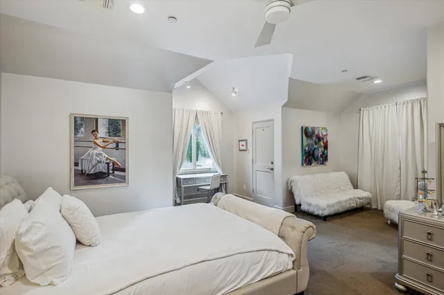 a bedroom with a bed and a couch