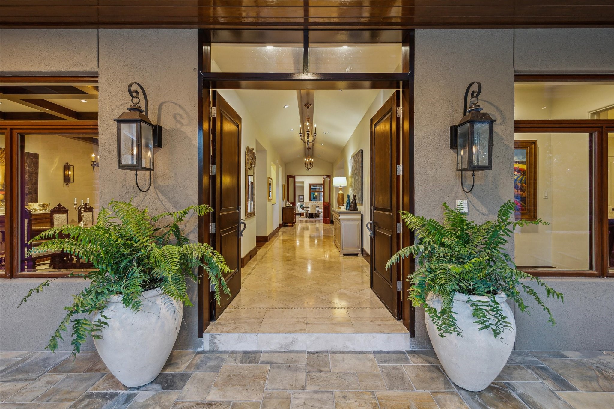 354 Piney Point Road Houston, TX 77024 - Photo 6 of 50 Elegant double-door entry with a covered slate-tile patio and transom windows above, bringing in abundant natural light.